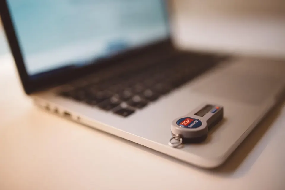 A hardware security token on a desk, one kind of device that can hold a passkey