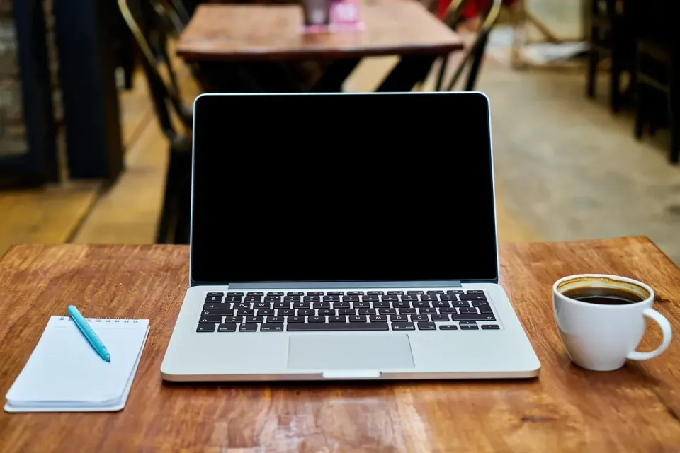 A laptop keyboard and login screen, where a passkey replaces the password prompt