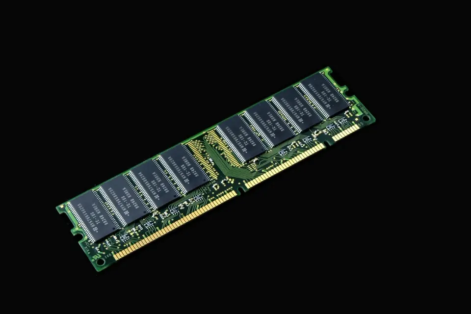 Computer hardware components laid out for inspection, such as the processor and parts Windows 11 requires