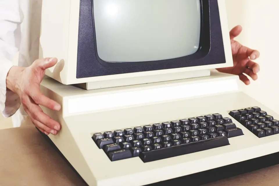 An old desktop computer and monitor, the kind of aging PC that may still run Windows 10