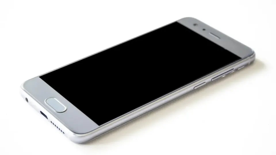 A smartphone with a fingerprint scan, a common way staff unlock a passkey