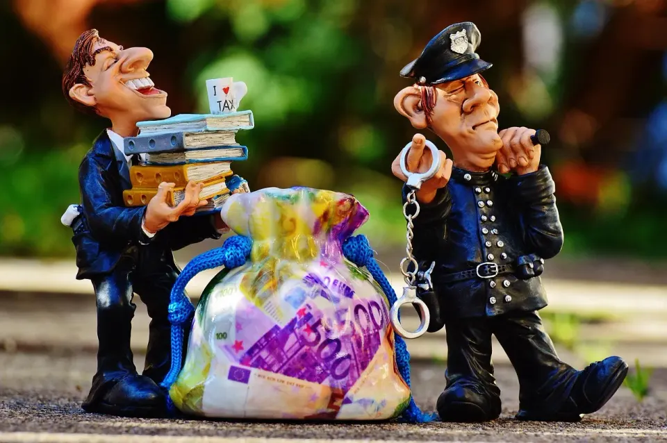 taxes, tax evasion, police, handcuffs